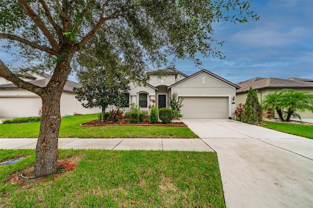 view of front of house with a front lawn and a garage