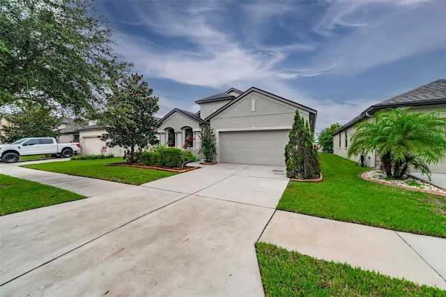 view of front of property with a front yard and a garage