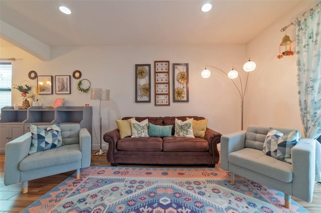 living room with wood-type flooring and lofted ceiling