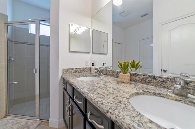 bathroom with vanity and walk in shower