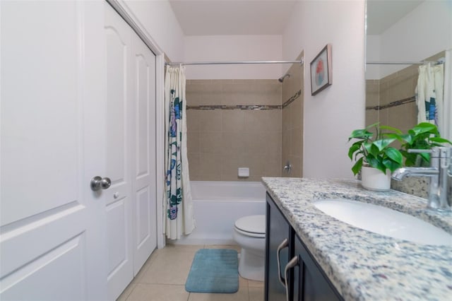 full bathroom with tile patterned floors, vanity, shower / bath combo, and toilet