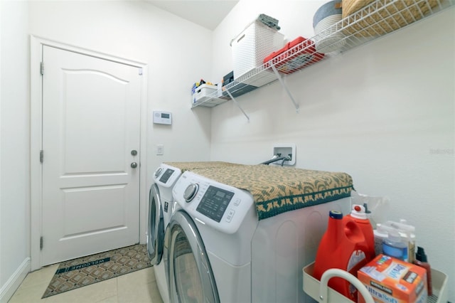 laundry room featuring light tile patterned floors and independent washer and dryer