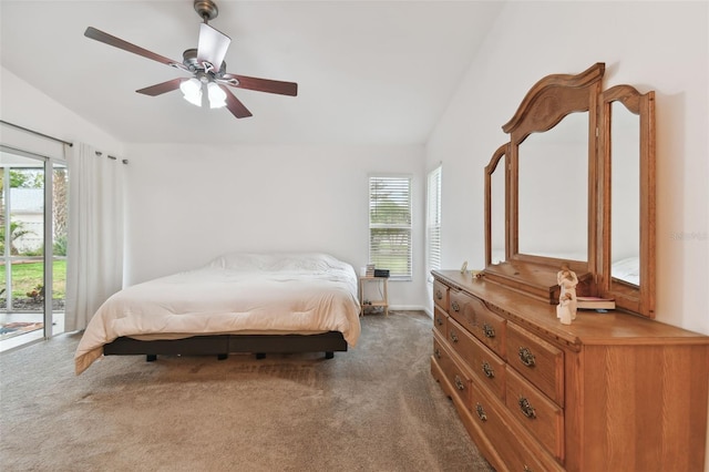 bedroom featuring access to outside, multiple windows, vaulted ceiling, and dark colored carpet