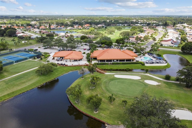 aerial view featuring a water view, view of golf course, and a residential view