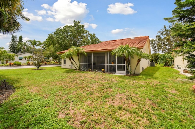 view of yard with a sunroom