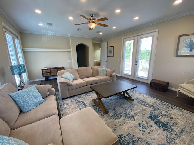 living room featuring ceiling fan, dark hardwood / wood-style flooring, french doors, and ornamental molding