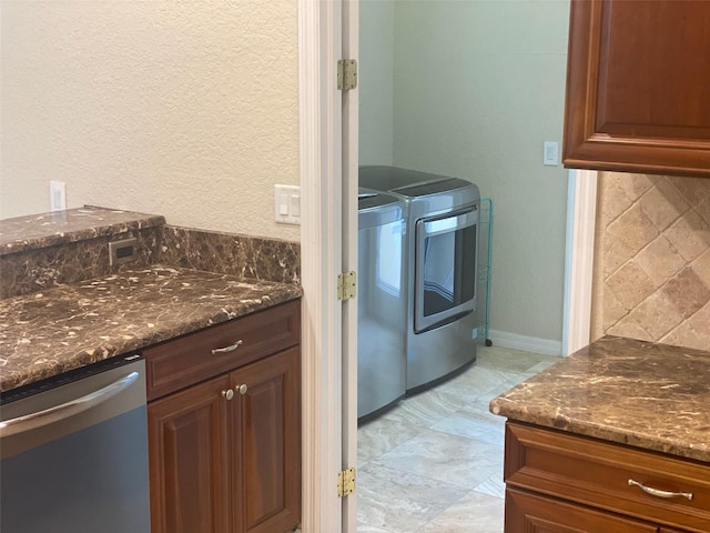 clothes washing area featuring washing machine and dryer