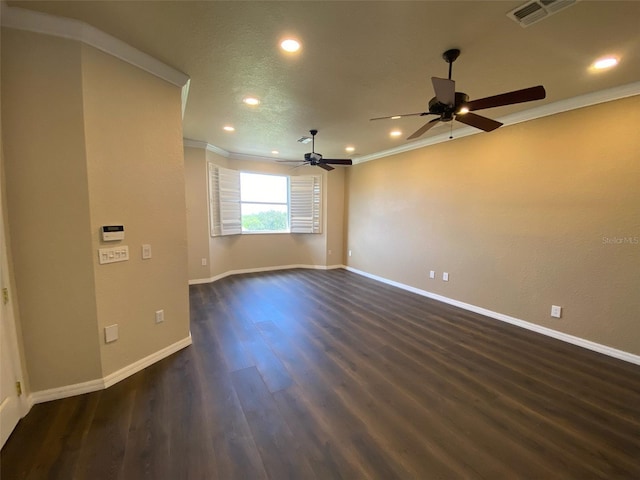 unfurnished room featuring crown molding, ceiling fan, dark wood-type flooring, and a textured ceiling