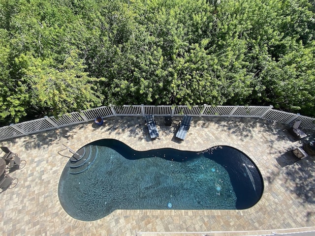 view of swimming pool featuring a patio area