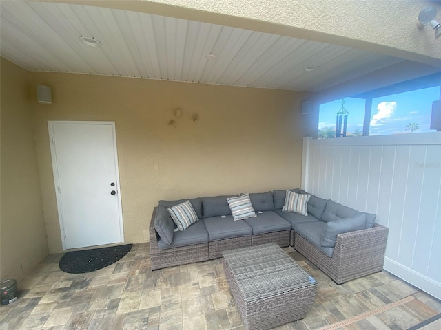 living room with lofted ceiling