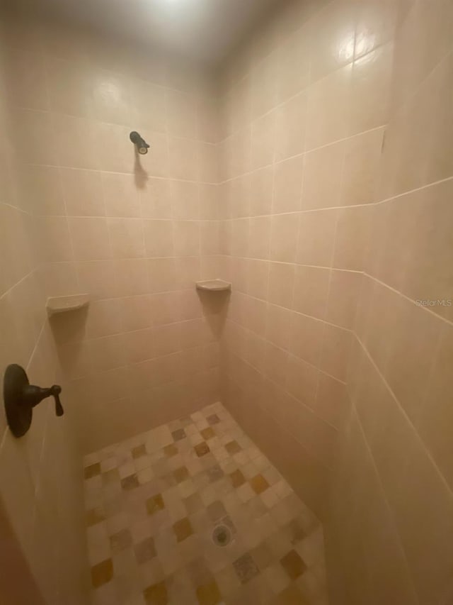 bathroom with tiled shower