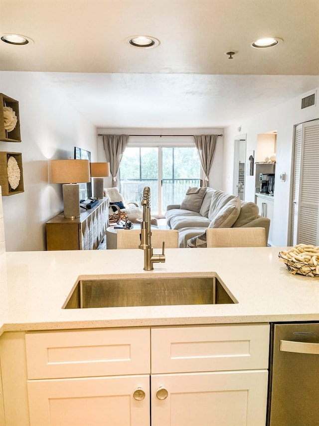 kitchen with sink and stainless steel dishwasher