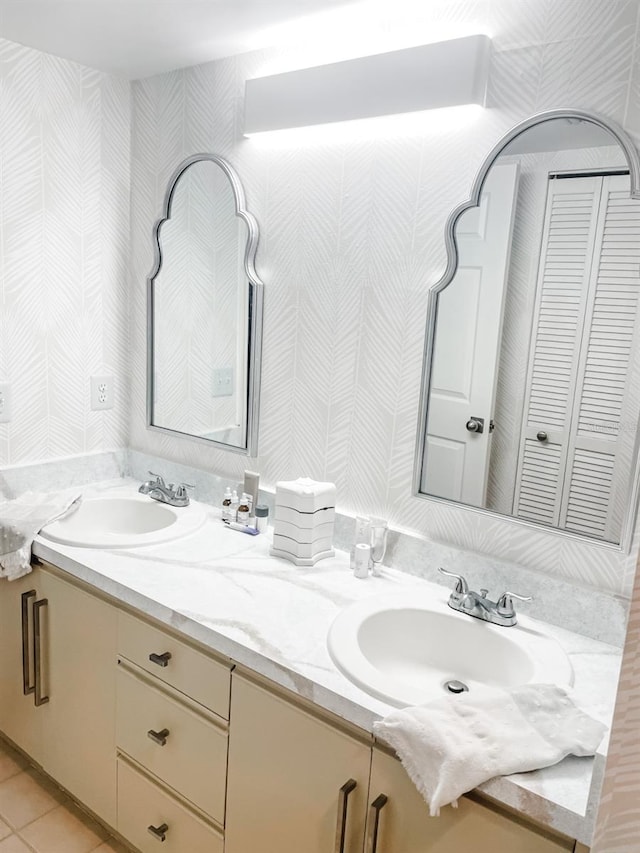 bathroom with tile patterned flooring and vanity