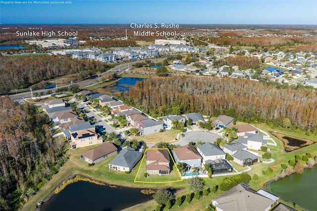 birds eye view of property with a water view