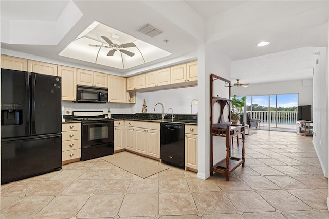 kitchen featuring cream cabinetry, sink, ceiling fan, and black appliances