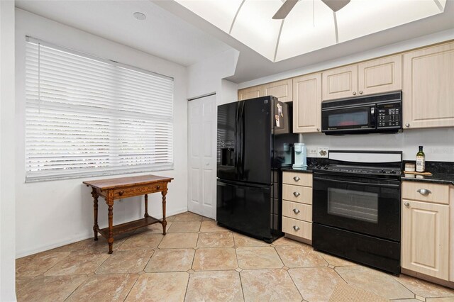 kitchen featuring ceiling fan and black appliances