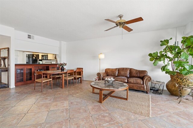 living room featuring ceiling fan