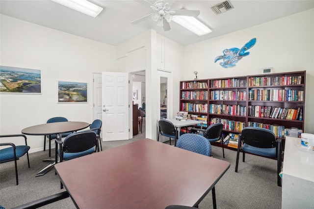 home office with ceiling fan and carpet floors