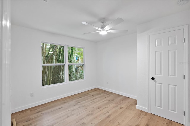 spare room featuring ceiling fan and light hardwood / wood-style floors