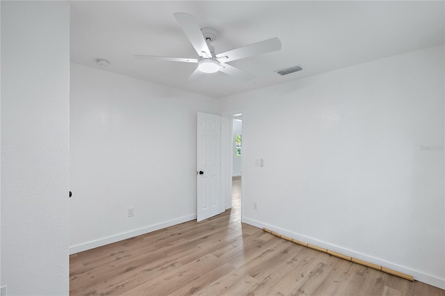 spare room with ceiling fan and light hardwood / wood-style flooring