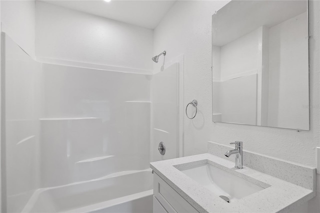 bathroom featuring vanity and tub / shower combination