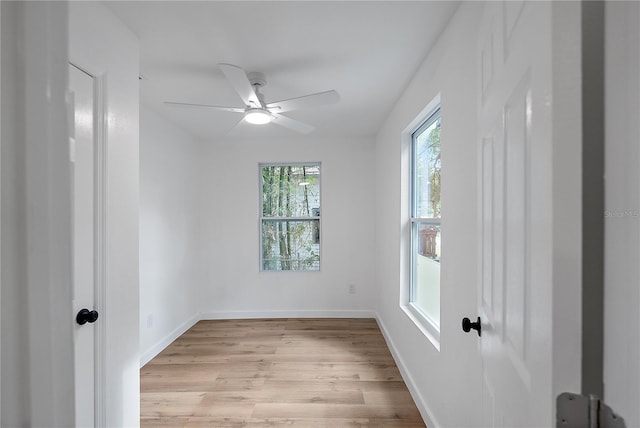 spare room with ceiling fan and light hardwood / wood-style flooring