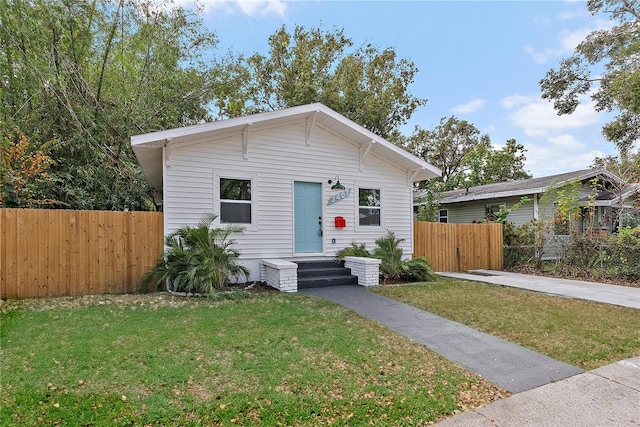 view of front of home with a front yard