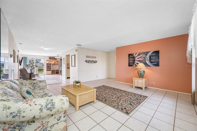 tiled living room with a textured ceiling