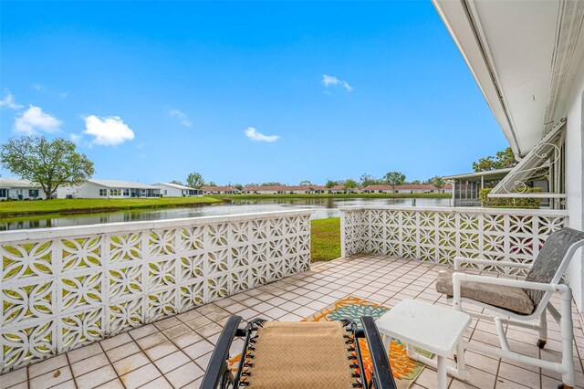 view of patio with a water view