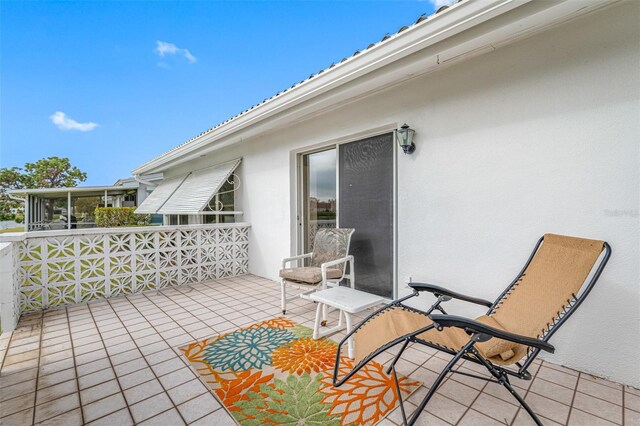 view of patio / terrace featuring a sunroom