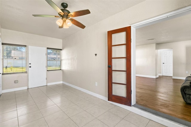 empty room featuring light wood-type flooring and ceiling fan