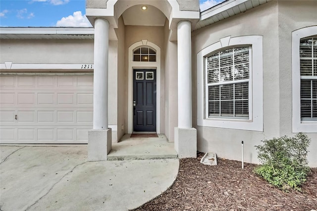 entrance to property featuring a garage