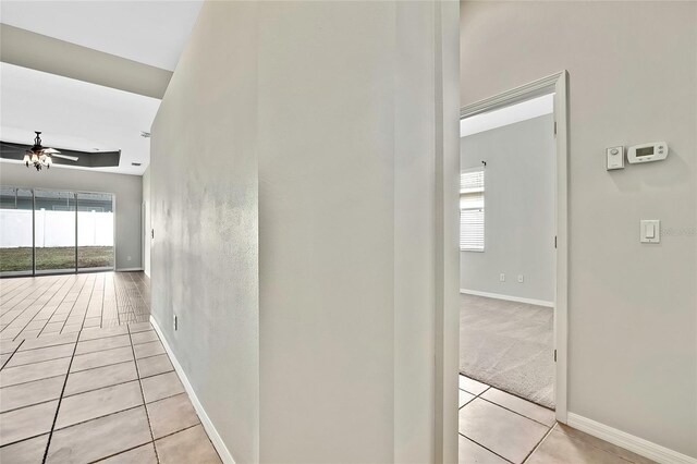 hallway with light tile patterned floors