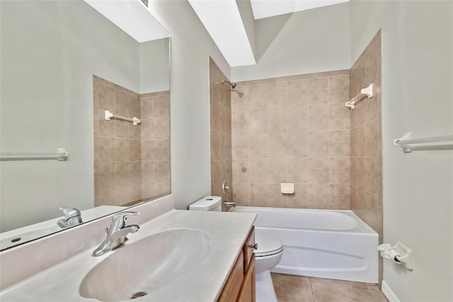 full bathroom with tile patterned floors, toilet, vanity, and tiled shower / bath