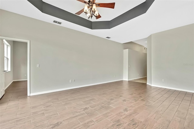 unfurnished living room featuring ceiling fan and light wood-type flooring