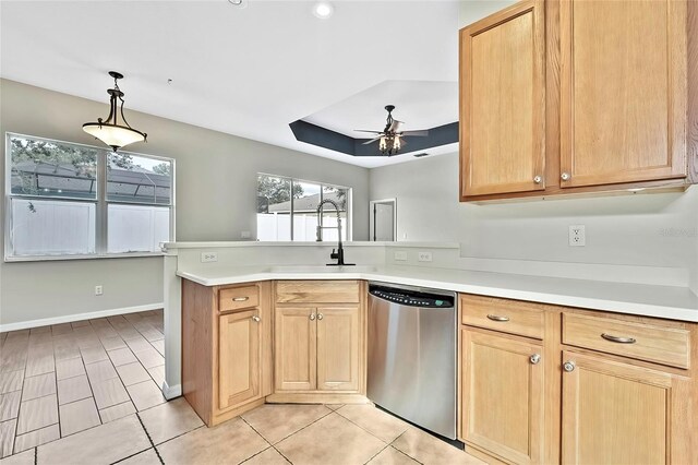 kitchen featuring kitchen peninsula, stainless steel dishwasher, ceiling fan, sink, and decorative light fixtures