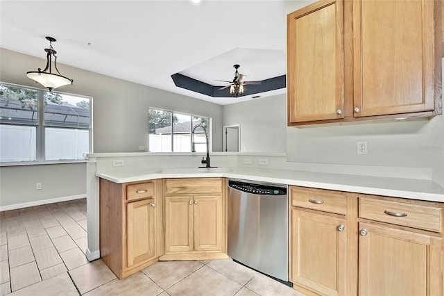 kitchen featuring ceiling fan, sink, hanging light fixtures, stainless steel dishwasher, and kitchen peninsula