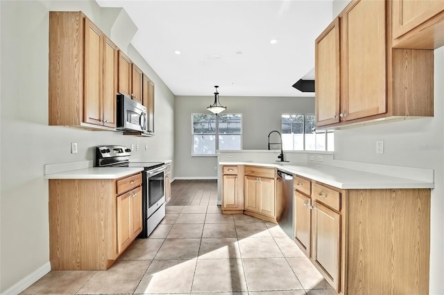 kitchen featuring light brown cabinetry, stainless steel appliances, sink, pendant lighting, and light tile patterned flooring