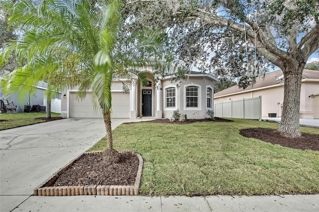 view of front of property featuring a front yard and a garage