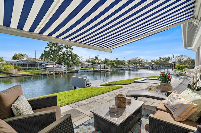 view of patio featuring a water view, an outdoor hangout area, and a boat dock