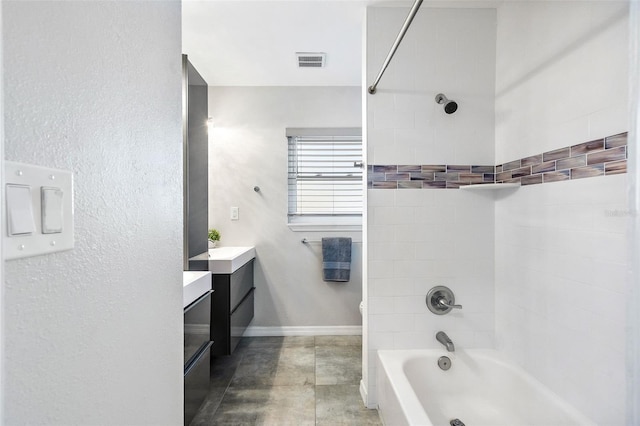 full bath with visible vents, baseboards, washtub / shower combination, toilet, and vanity