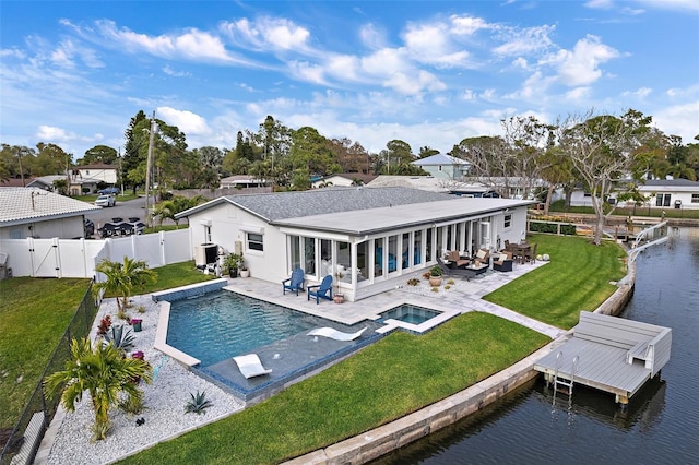 back of property featuring a patio area, a fenced backyard, a gate, and a lawn