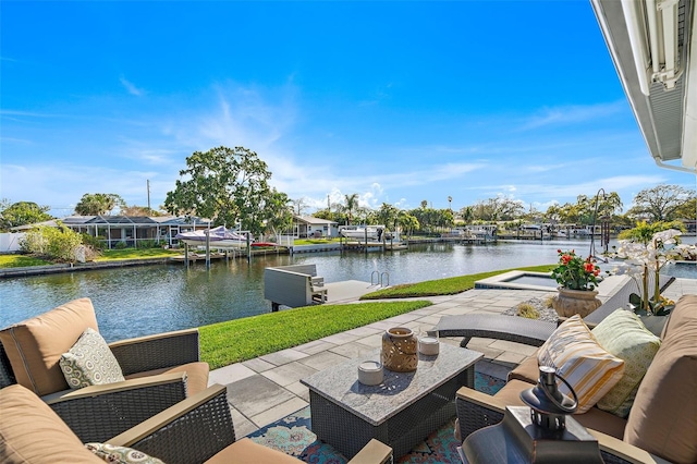 view of patio / terrace with an outdoor hangout area and a water view