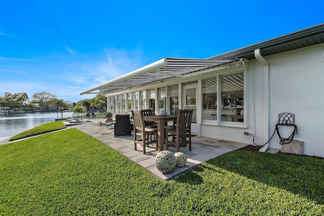 view of patio with a water view