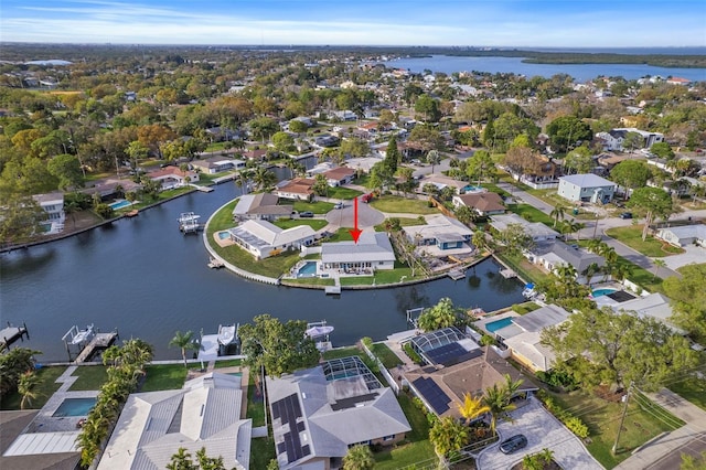 bird's eye view featuring a water view and a residential view