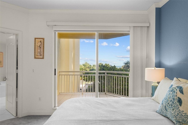 carpeted bedroom featuring access to exterior, crown molding, and ensuite bath