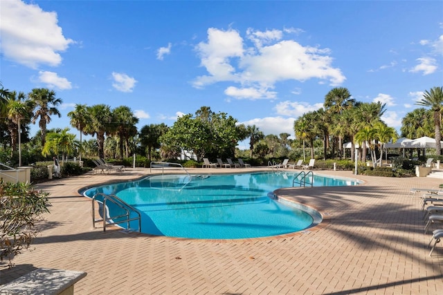 view of swimming pool featuring a patio area