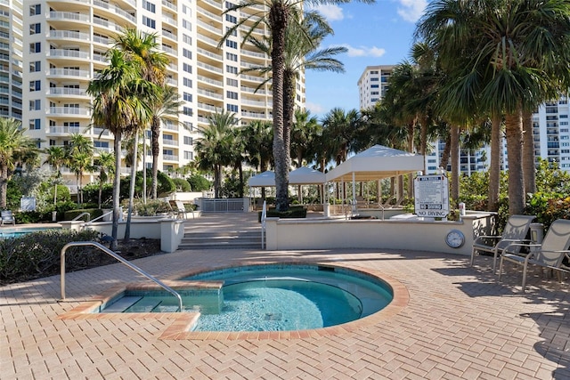 view of pool with a community hot tub