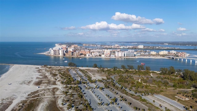 bird's eye view with a water view and a view of the beach