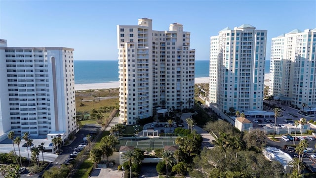 view of city with a water view and a beach view